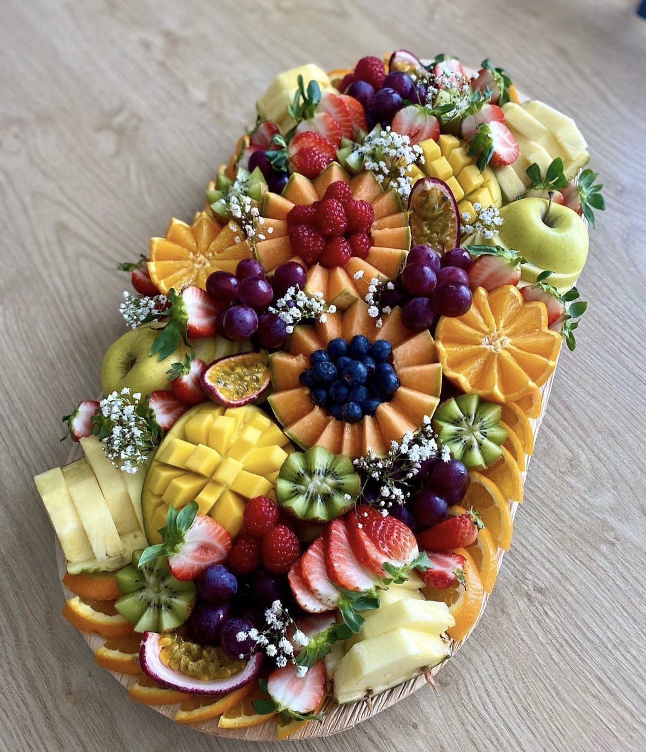 Entertainer's fruit board with a colorful seasonal fruit arrangement