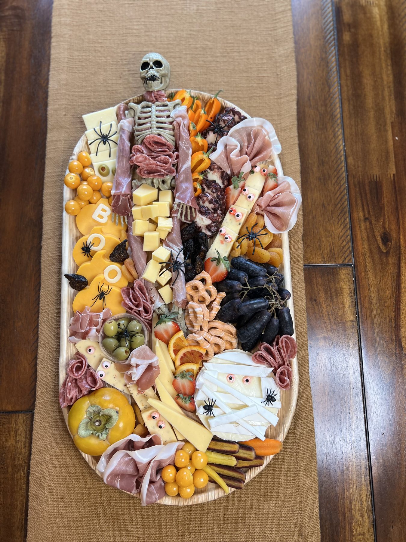 Halloween Skeleton charcuterie board with themed details